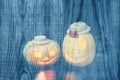 Ghostly Halloween pumpkins on a wooden background Royalty Free Stock Photo