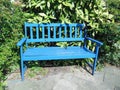 Blue wooden bench empty in park Royalty Free Stock Photo