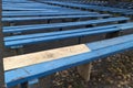 Blue wooden benches with unpainted part