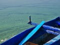 Blue wooden boat detail on  lake green water with algae.  Kastoria, Greece Royalty Free Stock Photo