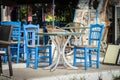 Blue wooden chairs and table at traditional Greek tavern Royalty Free Stock Photo