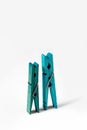 Blue wooden clothespins on a white background. Concept. Royalty Free Stock Photo