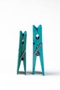 Blue wooden clothespins on a white background. Concept. Royalty Free Stock Photo