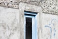 Blue wooden door with a black glass of a maldivian house Royalty Free Stock Photo