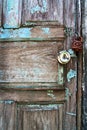 Background closeup of blue and brown color old wooden door, grunge and double lock with old keys, Abstract and backdrop. Royalty Free Stock Photo