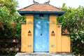 Blue wooden door of a house designed and decorated in Balinese style is beautiful and durable yet has a designer design that is