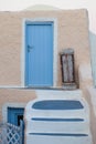 Blue wooden door and old stair in Santorini, Greece Royalty Free Stock Photo
