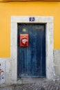 Blue Door of an Yellow House, Lisbon, Portugal Royalty Free Stock Photo