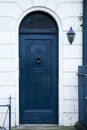 Blue wooden door with stairs part of a house Royalty Free Stock Photo