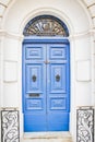 Blue Wooden Doors with Black Metal Knockers Royalty Free Stock Photo