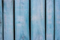 Blue wooden fence background. The rough texture of the old weathered painted board Royalty Free Stock Photo