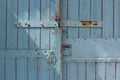 Blue wooden gate with strips from metal Royalty Free Stock Photo