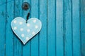 Blue wooden heart on blue wodden background