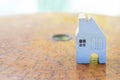 Blue wooden miniature house design on wooden Chinese compass