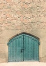 Blue wooden old vintage door in brick wall historical Royalty Free Stock Photo