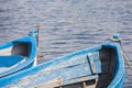 Blue wooden rowing boat on lake. Royalty Free Stock Photo