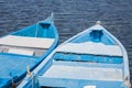 Blue wooden rowing boat on lake. Royalty Free Stock Photo