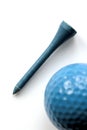 Blue wooden tee - golf ball on foreground Royalty Free Stock Photo