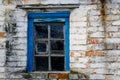 Blue wooden window in old brick wall Royalty Free Stock Photo