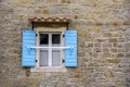 Blue wooden window shutters on the old house Royalty Free Stock Photo