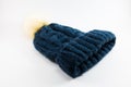 Blue wool hat on white background