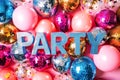 Blue word PARTY on festive disco ball background