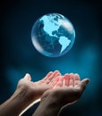 Blue world in hands Royalty Free Stock Photo