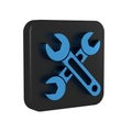 Blue Wrench icon isolated on transparent background. Spanner icon. Black square button.