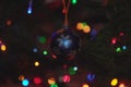 Blue xristmas ball with silver snowflake weighs on branch of Christmas tree Royalty Free Stock Photo