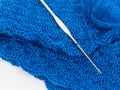 Blue yarn ball and crochet hook Royalty Free Stock Photo