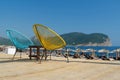 Blue and yellow armchairs on the Buljarica beach, Montenegro Royalty Free Stock Photo