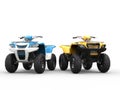 Blue and yellow ATVs Royalty Free Stock Photo
