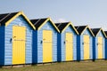 Blue and yellow beach huts