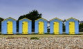 Blue and Yellow Beach Huts Royalty Free Stock Photo