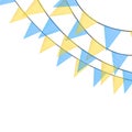 Blue and yellow bunting garlands with flags made of shredded pieces of fabric. Decorative multicolored party pennants for festival Royalty Free Stock Photo