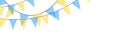 Blue and yellow bunting garlands with flags made of shredded pieces of fabric. Decorative multicolored party pennants for festival Royalty Free Stock Photo