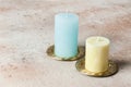 Blue and yellow candles on brass candlesticks