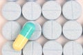 Blue Yellow capsule on blue pills lined up Royalty Free Stock Photo