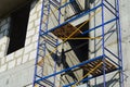 Blue and yellow construction scaffolding of a Russian building under renovation Royalty Free Stock Photo