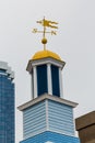 Blue and Yellow Cupola with Windvane Royalty Free Stock Photo