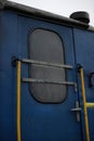 blue-yellow details of the train detail of the doors and connections of two cars