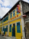 Blue and yellow doors and window shutters in Chinatown Kuala Lumpur.