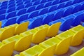 Blue and yellow empty stadium seats Royalty Free Stock Photo