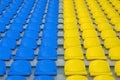 Blue and yellow empty stadium seats Royalty Free Stock Photo