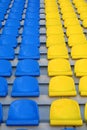 Blue and yellow empty stadium seats Royalty Free Stock Photo