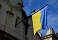 blue and yellow flags hang from the occupied houses, someone hung Royalty Free Stock Photo