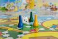 Blue, yellow and green plastic chips, dice and Board games for children Royalty Free Stock Photo