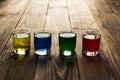 Blue yellow green red alcohol shot drinks Royalty Free Stock Photo