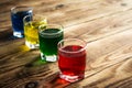 Blue yellow green red alcohol shot drinks Royalty Free Stock Photo