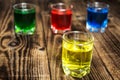 Blue yellow green red alcohol shot drinks Royalty Free Stock Photo